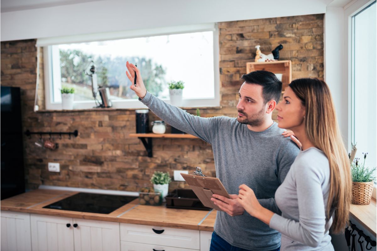 Couple talking about home kitchen renovation