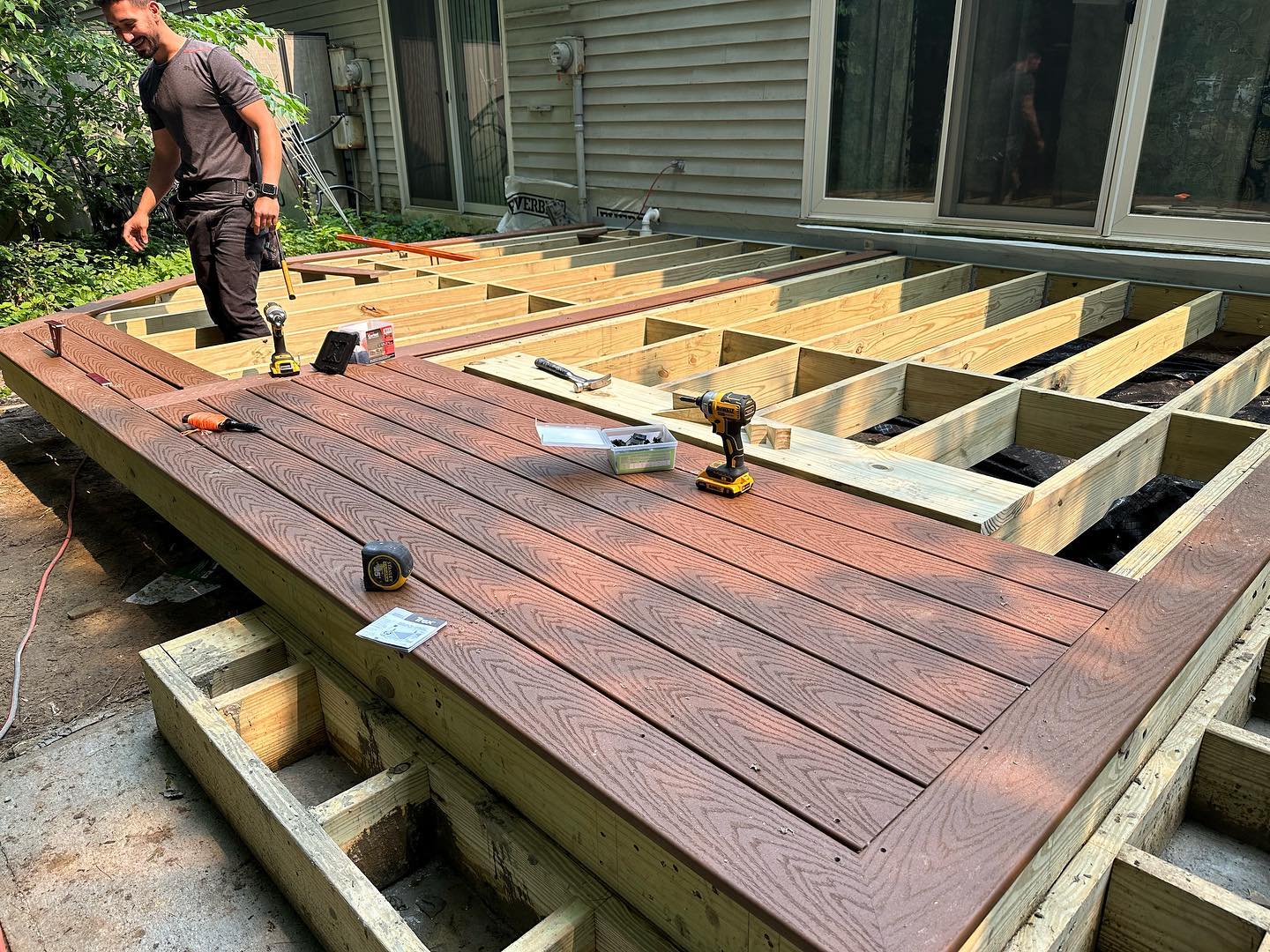 Home remodeler working on a deck patio outdoor