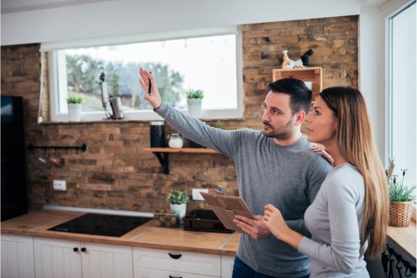 couple talking about kitchen renovation 