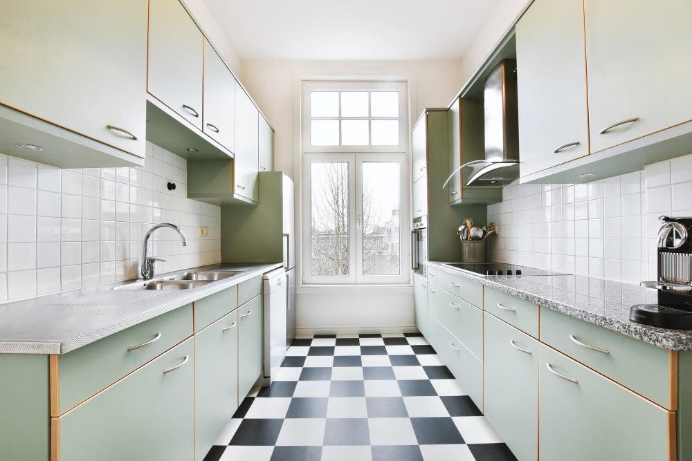 Kitchen featuring checkered flooring, blending classic design with modern elements for a vibrant and inviting cooking space.