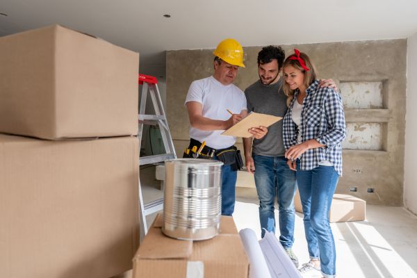 couple renovating their basement and consulting to basement contractor