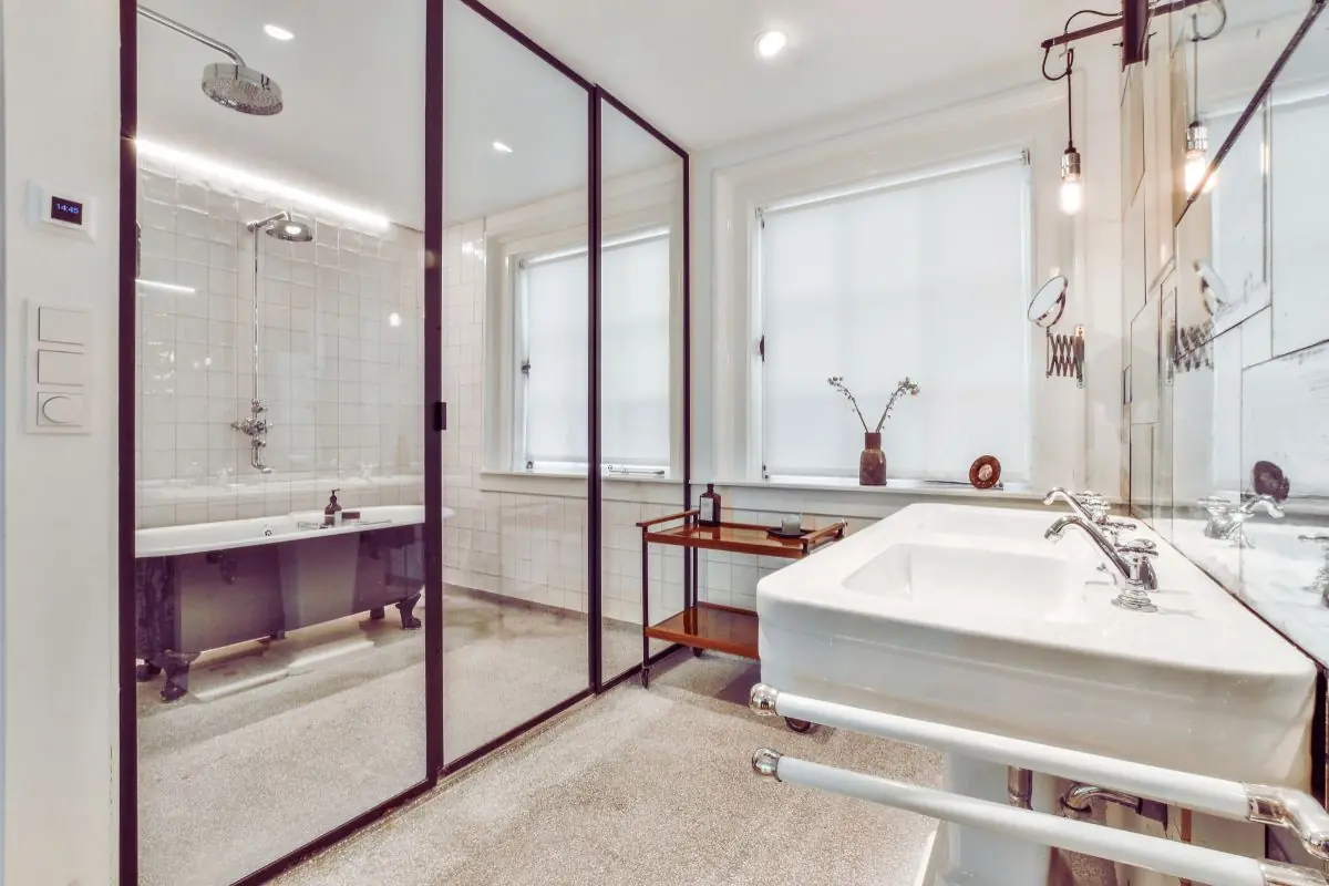 Big bathroom with soaker tub behind glass wall