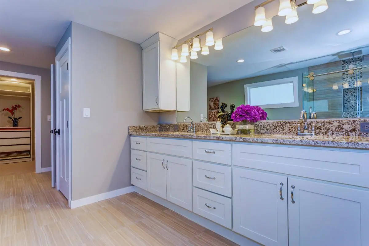 Elegant bathroom with long white vanity cabinet