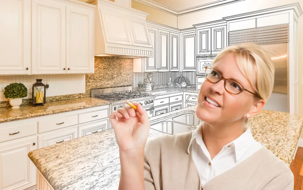 Schedule Your Kitchen Design Consultation: A Woman Sketching Her Ideal Kitchen with Care