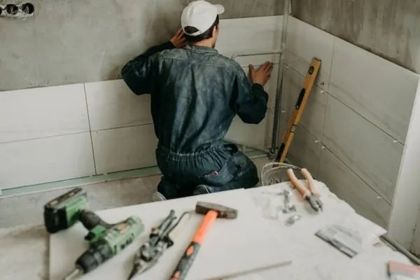 bathroom remodel contractor finishing bathroom project in Newton MA