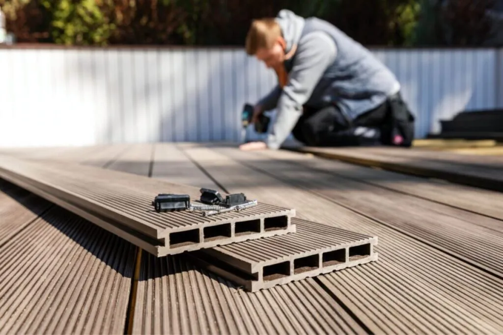 deck contractor working on a an outdoor deck renovation in Newton MA