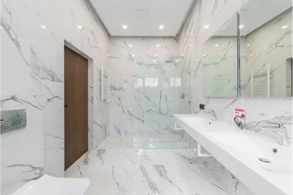 luxury bathroom remodeled design with marble finish for wall