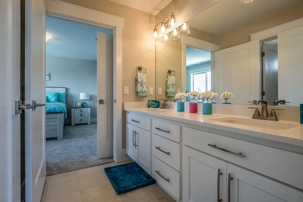 new bathroom design with white countertops installed