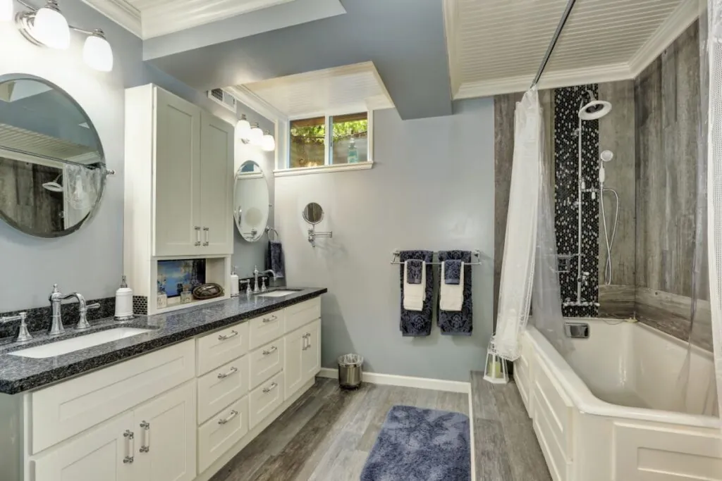 basement bathroom interior in gray and white tones