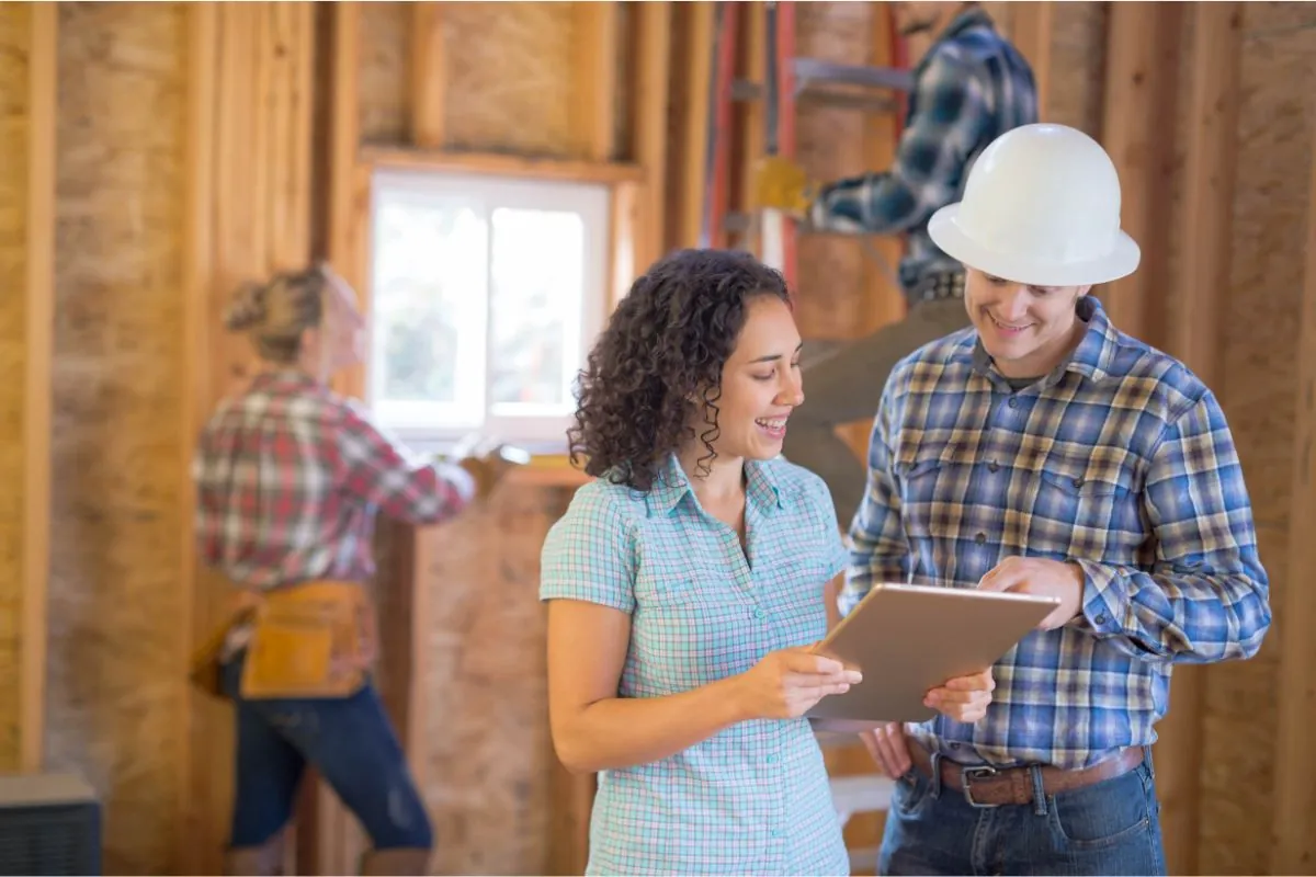 client and contractor discussing home remodeling plan